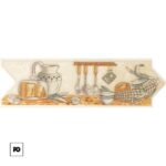 Decorative still life of a rustic kitchen counter with bread, cheese, jug, hanging utensils, corn, pineapple, and a teacup under a wooden rack.