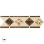 Decorative ceramic tile trim with beige diamonds and brown insets in a diagonal pattern along a narrow border edge.