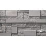 Gray stone wall with rectangular, textured blocks arranged in a staggered pattern