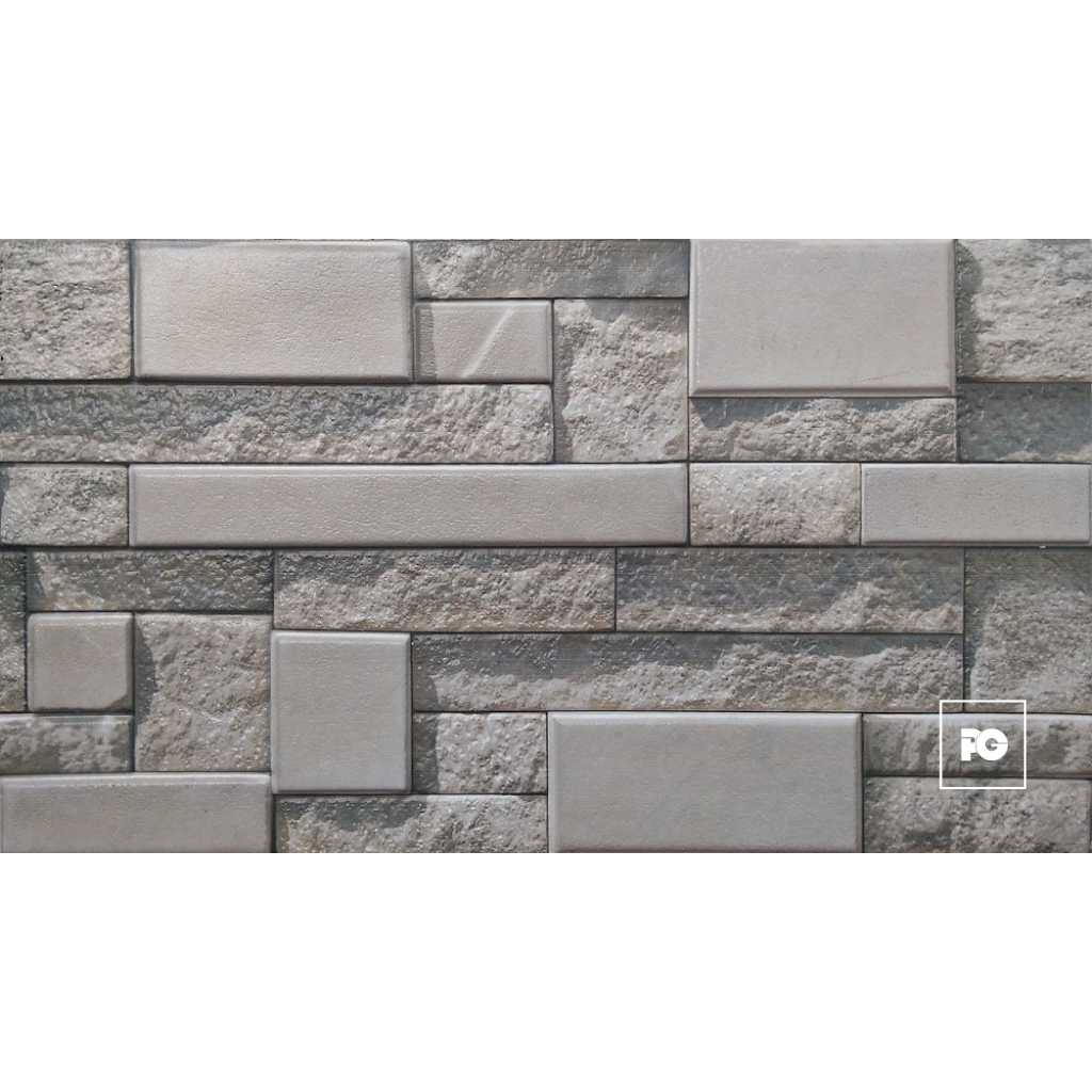Gray stone wall with rectangular, textured blocks arranged in a staggered pattern