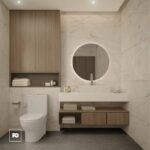 Modern bathroom with marble walls, a round backlit mirror, and a wooden vanity with open shelf and folded towels nearby.