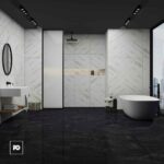 Modern bathroom with marble walls and dark floor, a freestanding oval tub by a large window, and a wall-mounted sink with round mirror on the left.