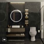 Piso porcelánico tipo mármol negro brillante milan nero 60 × 120 cm-tendenzza-2-ok | Plomería García Dark marble bathroom with a round backlit mirror above a floating vanity and sink, facing a modern toilet.