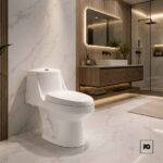Modern bathroom with a white one-piece toilet, marble walls, and a wooden vanity with a backlit mirror.