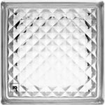 Close-up of a square glass tile with a repeating diamond facet pattern and beveled edges; small logo in the lower-left corner.