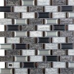 Malla30x30-turin-cenezzia-ok | Plomería García Decorative wall made of rectangular metal tiles in silver, gray, and black tones with brown accents, forming a brick-like pattern. (bottom-left shows a small fg watermark)