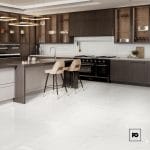 Modern kitchen with dark wood cabinetry, a central island, and beige bar stools on a glossy white tiled floor under pendant lights.