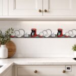 White kitchen with decorative tile border showing plates, cups and two red espresso machines along a marble counter surface.