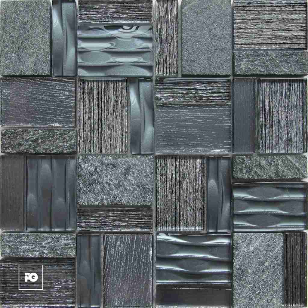 Close-up of a dark gray stone tile mosaic with varied textures—smooth, grooved, and rough surfaces—featuring a small white PG logo in the bottom-left corner.